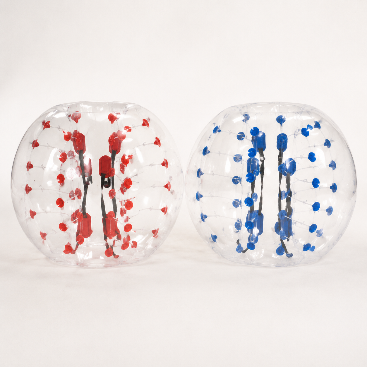 Pair of transparent adult-size inflatable bumper balls